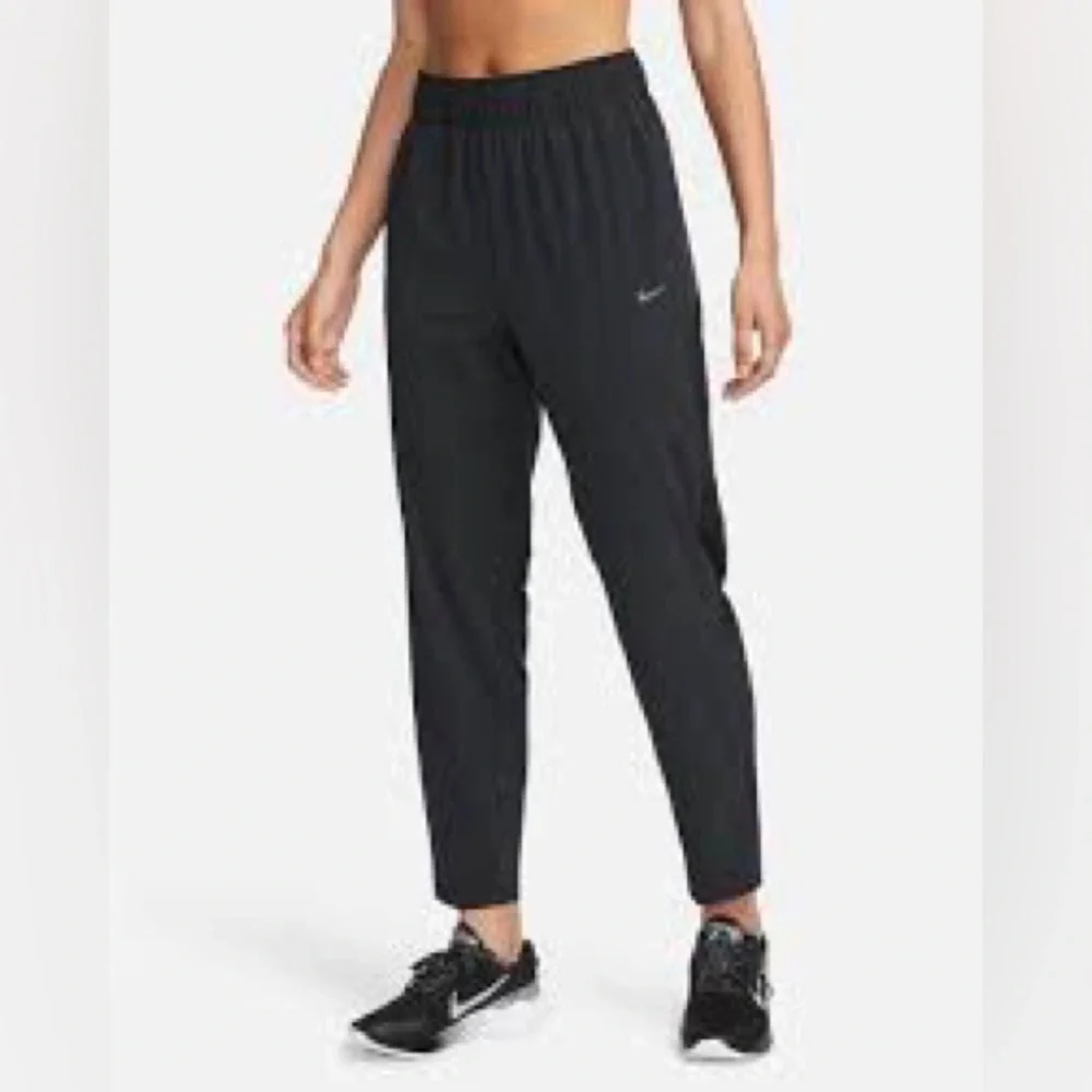 Nike Dri Fit Women's Charcoal Track Joggers with White Swoosh